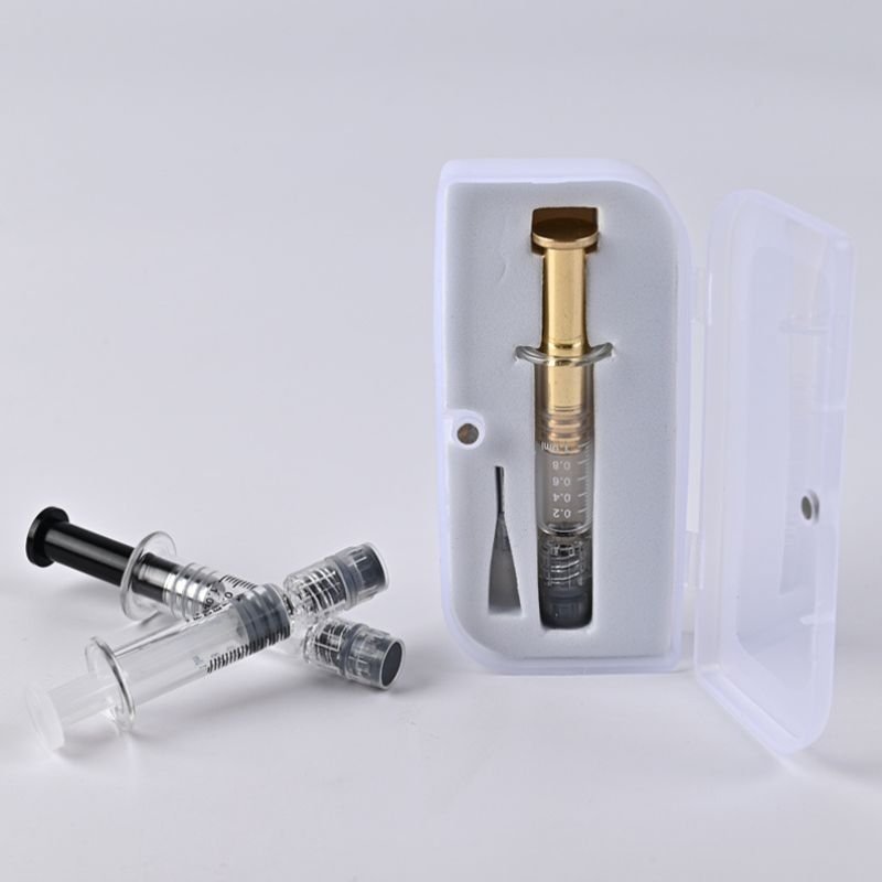 Image of cannabis syringe in a plastic magnetic box