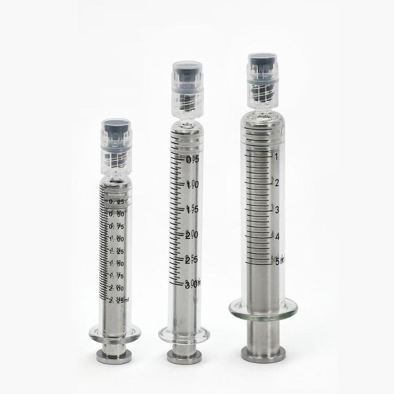 Glass syringes with silver metal plungers