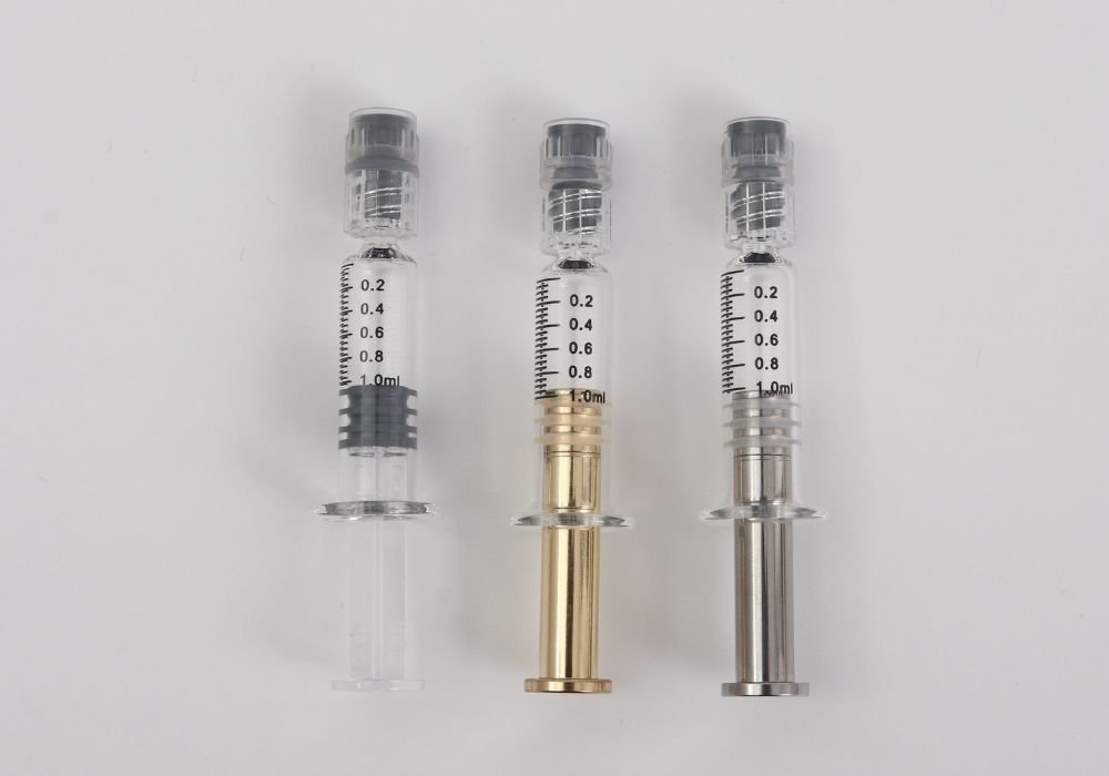 image of glass syringe with different plungers